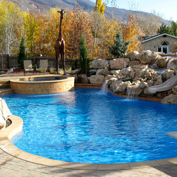 Luxury inground pool with built-in spa and custom features