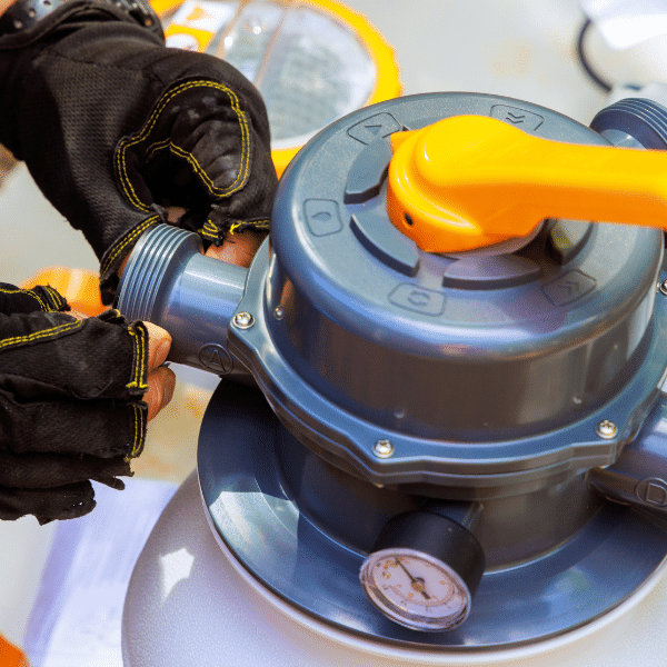 Property manager and pool technician shaking hands beside an indoor lap pool