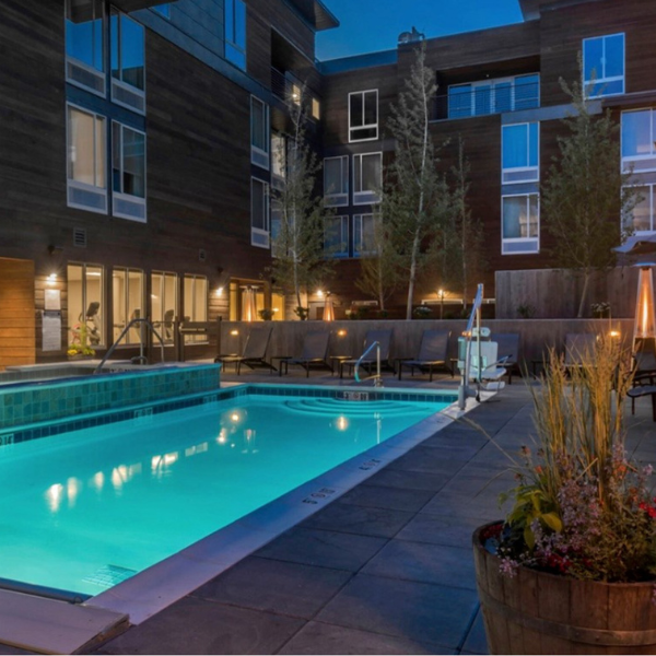 Warm backyard pool with consistent comfort from heater.