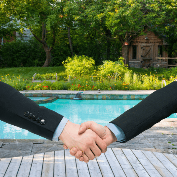 Technician testing pool water with a digital meter and documenting readings
